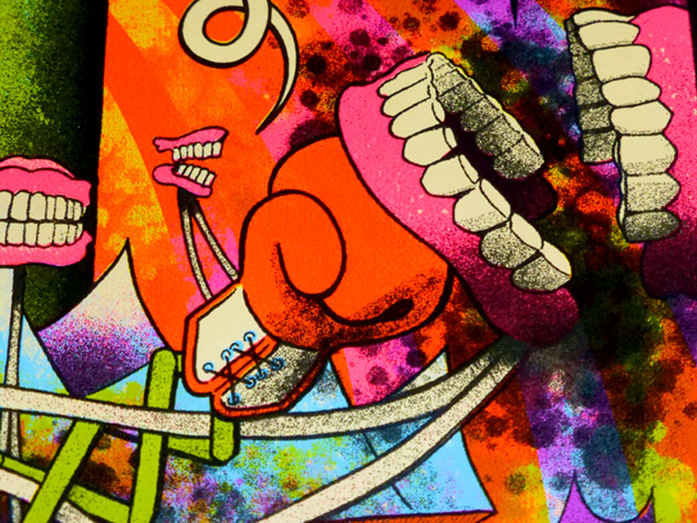 close up detail shot of our hero's boxing-gloved fist smashing the chattering monster in the chompers