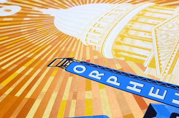 Close up of the UM 2000 gig poster showing shiny metallic gold/orange ink in the sky